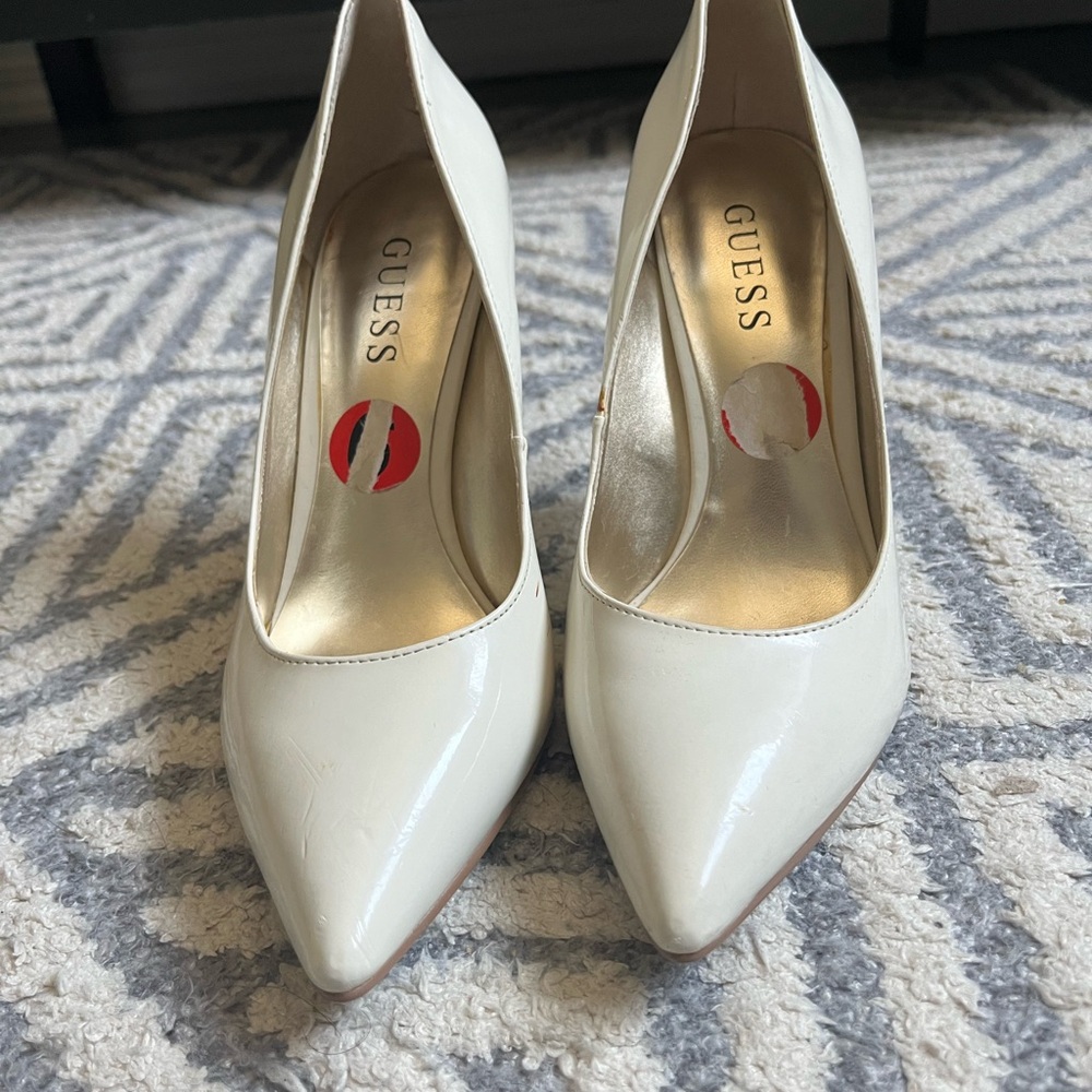 white pointy leather heels by GUESS